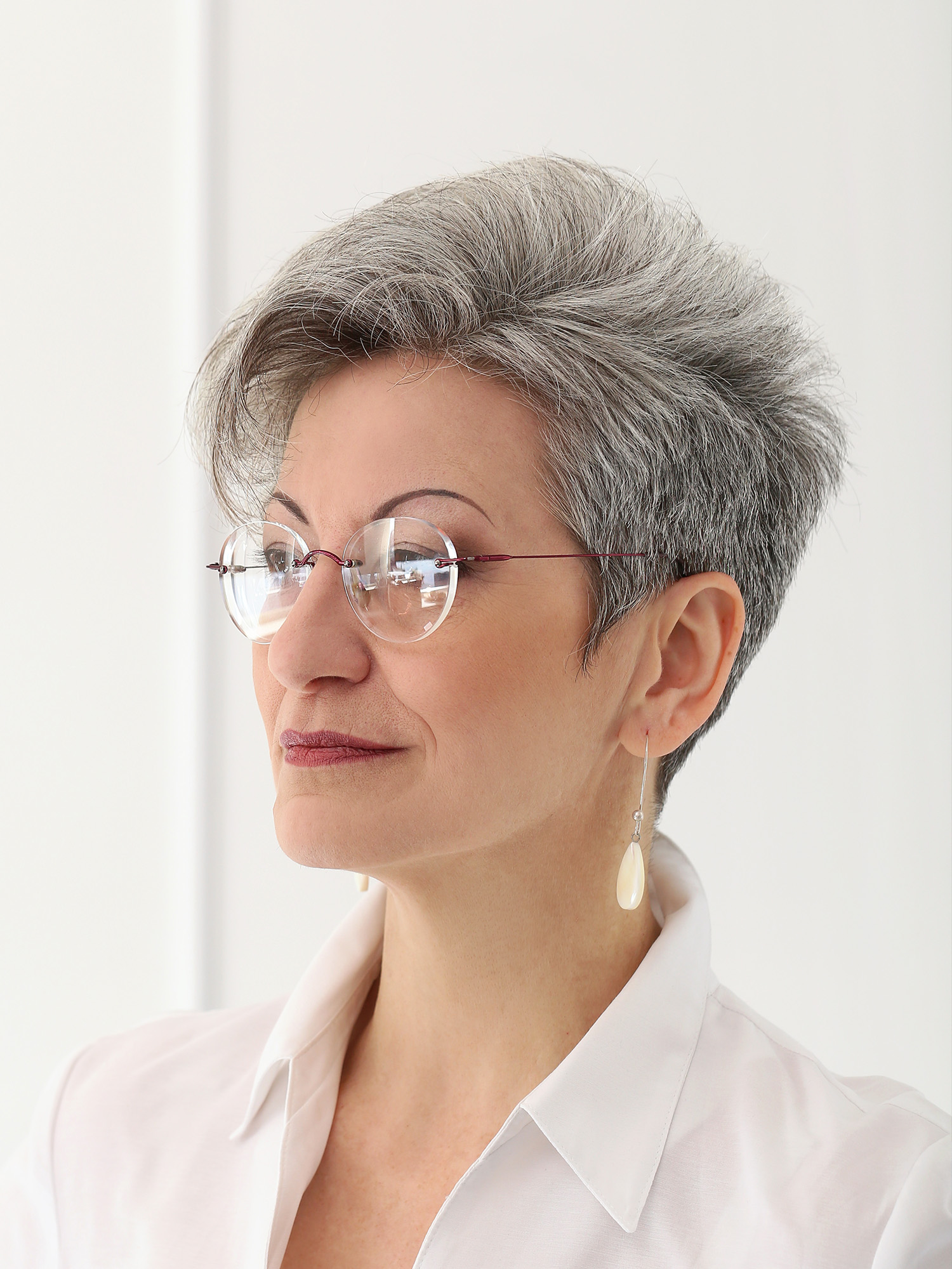 An older woman with a sharp jawline.